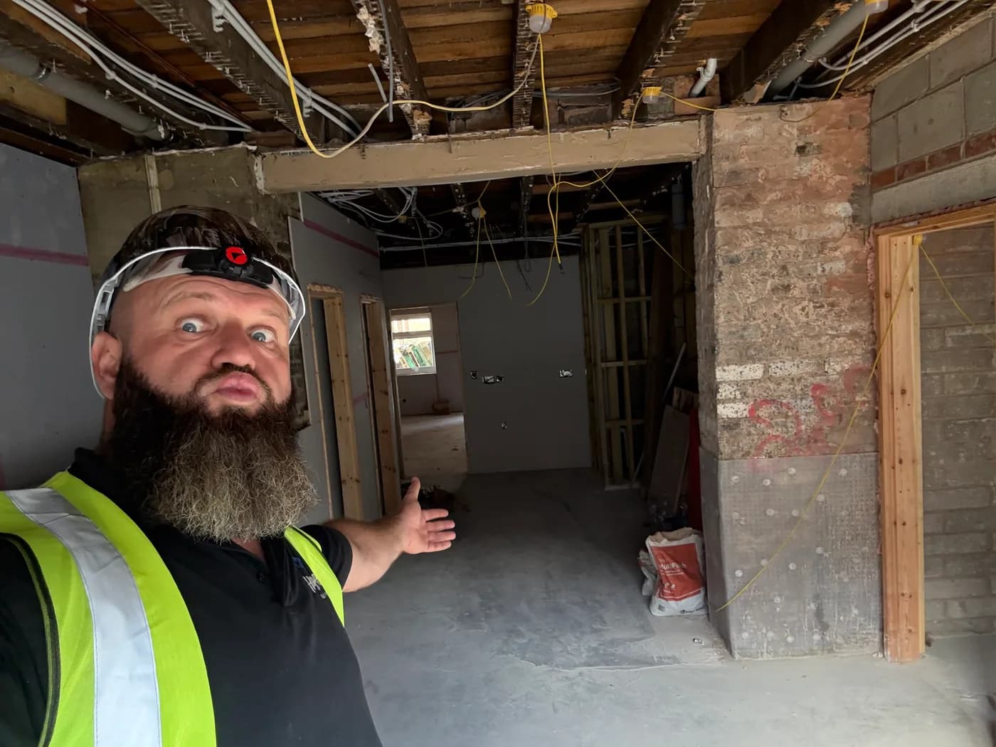 Structural floor and ceiling timbers exposed during a HYPE strip-out, with plasterboard and finishes removed.