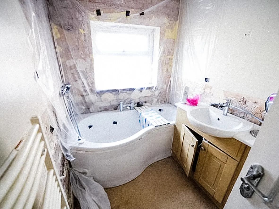 Before · bathroom stripped to bare brick by the previous builder