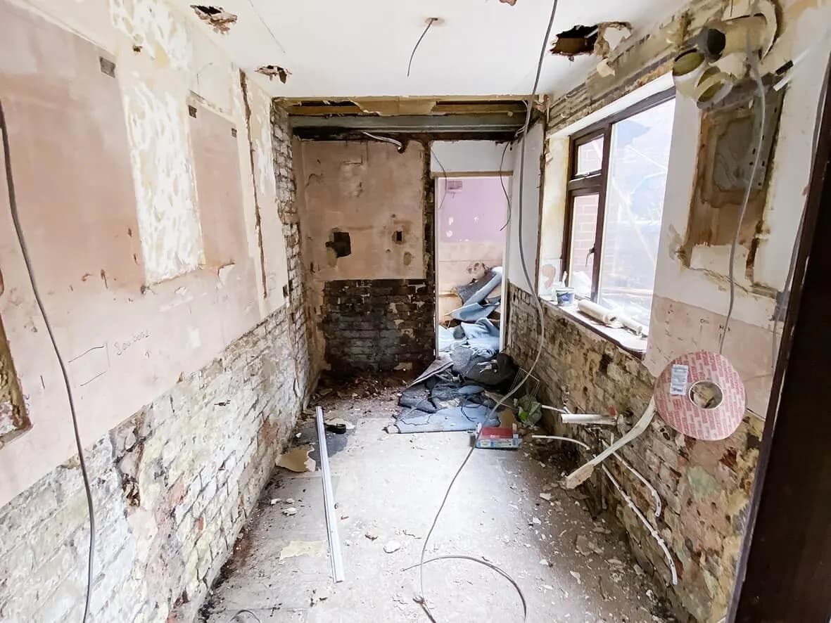 Strip-out · back room taken back to brick