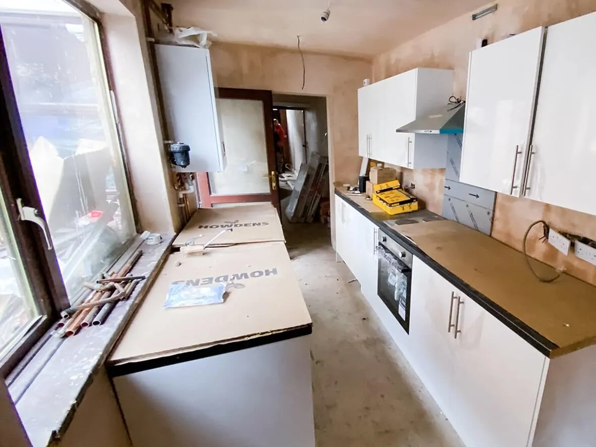 75% · kitchen worktops and appliances being installed