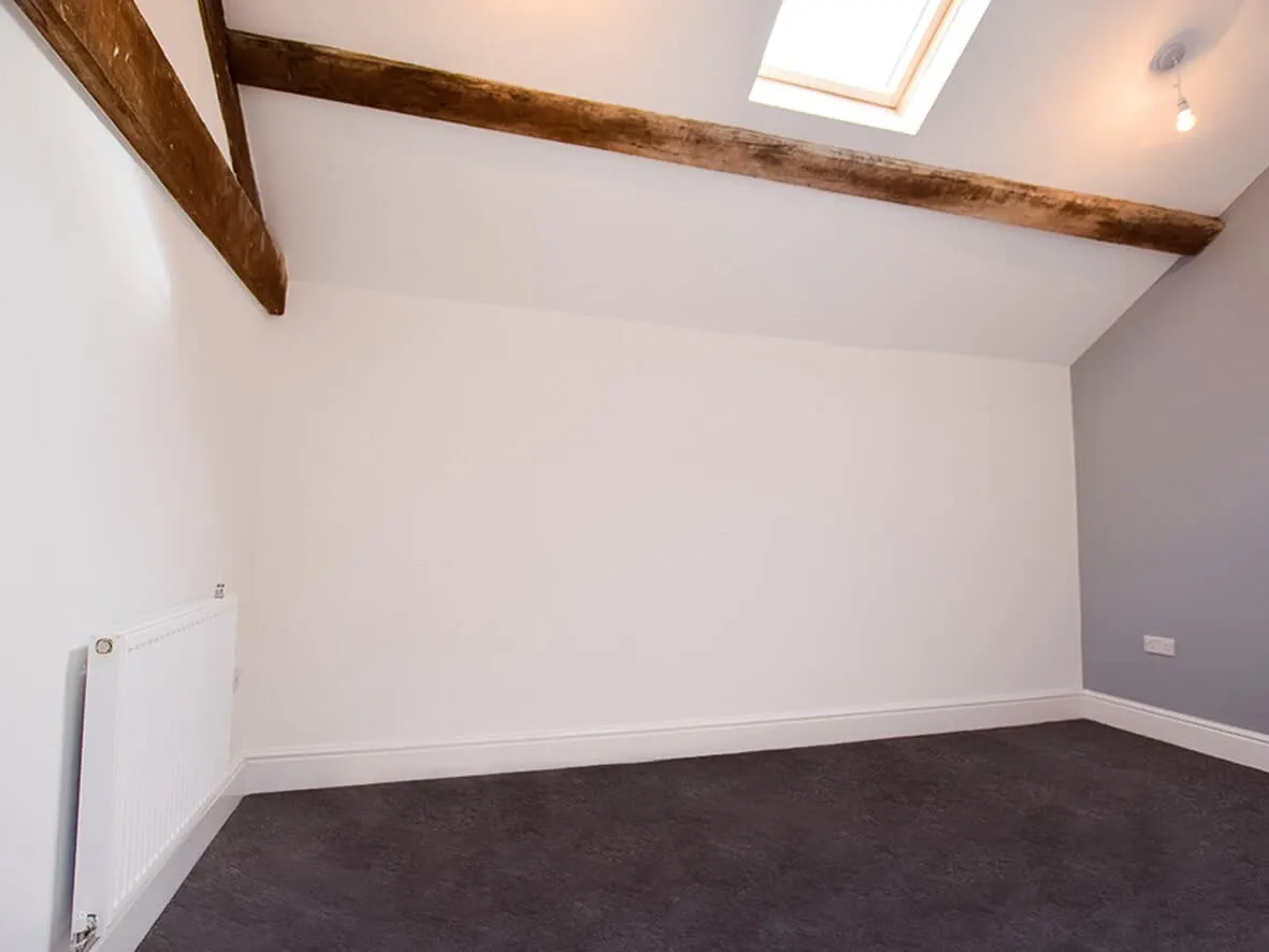Complete · open-plan ground floor with retained oak purlins