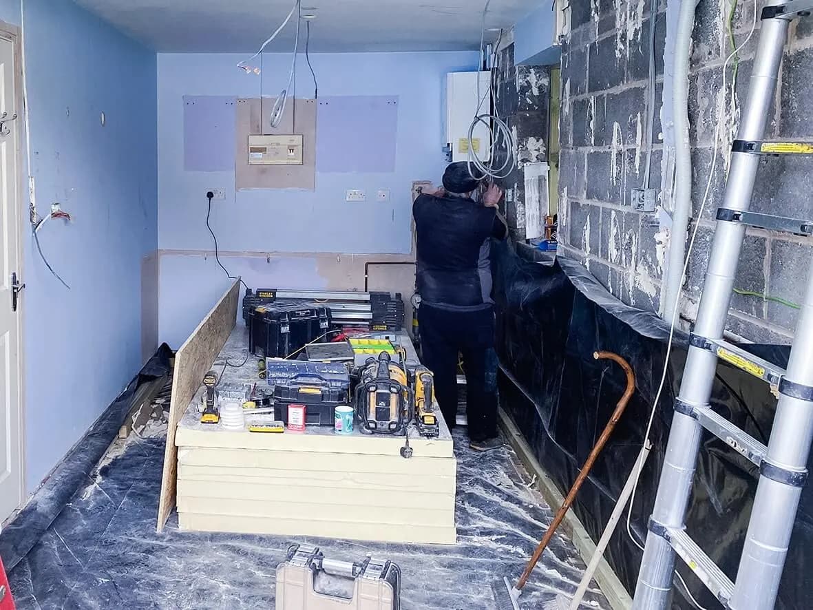 Mid-build · Georgian-bar window installed