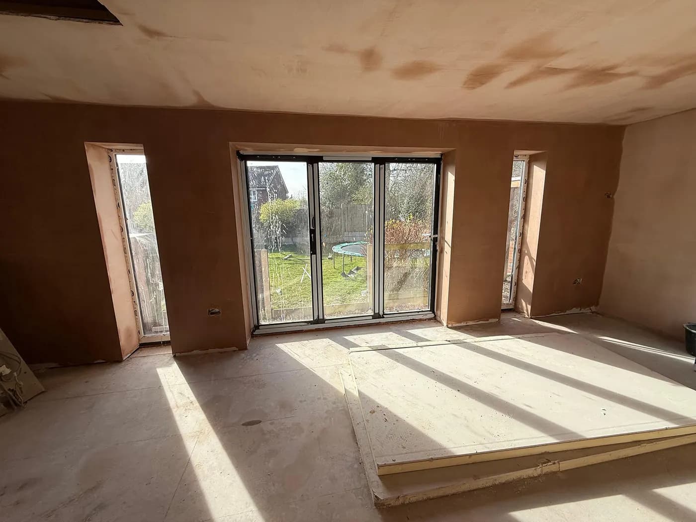 Mid-build · communal corridor framing