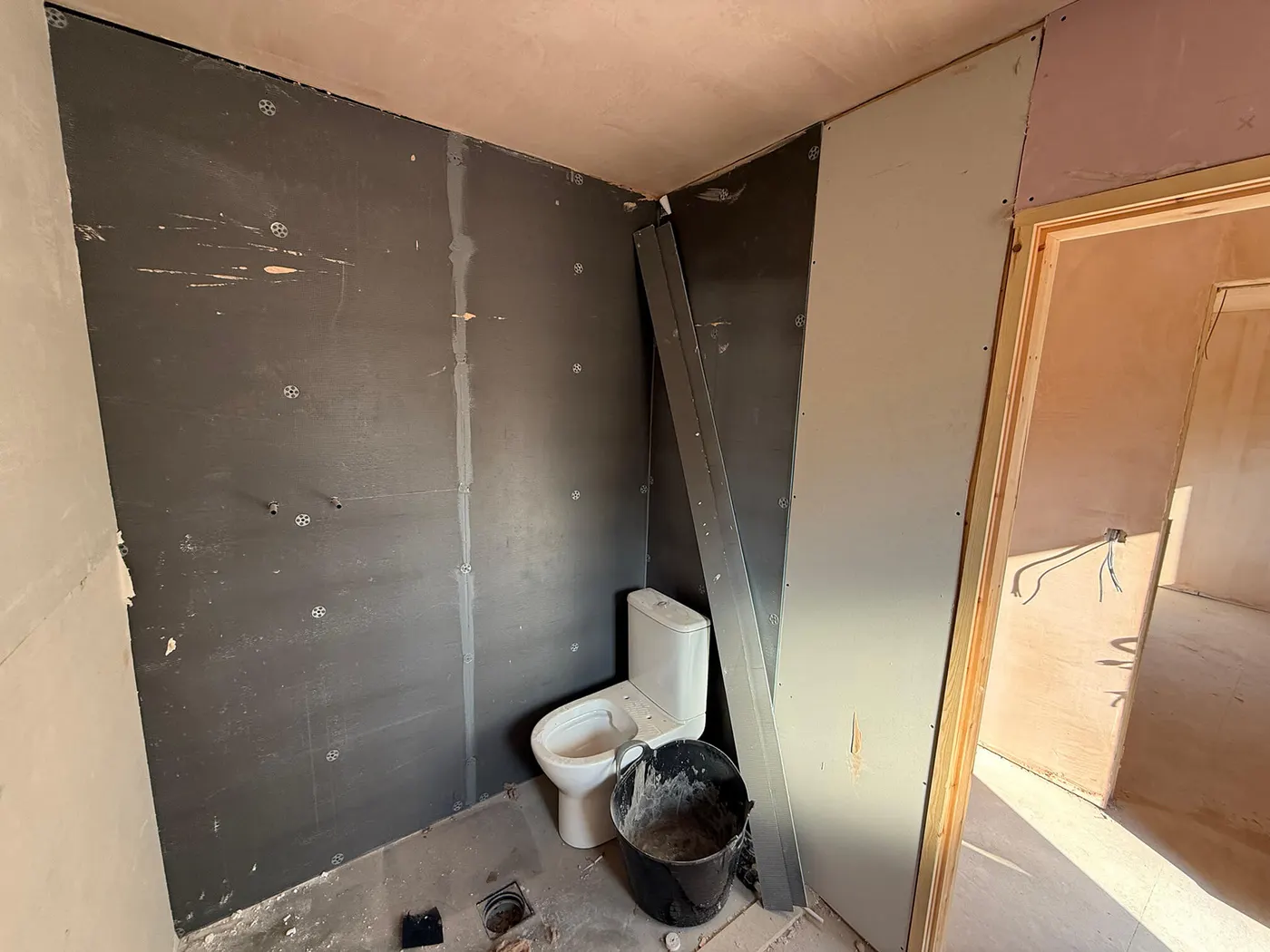 Mid-build · bathroom rough-in
