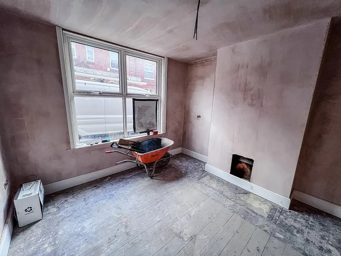 Mid-build · replastered walls