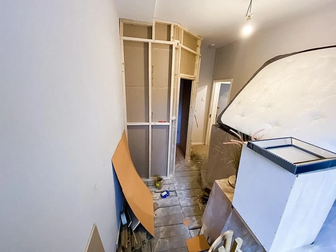 Mid-build · open-plan kitchen-lounge forming