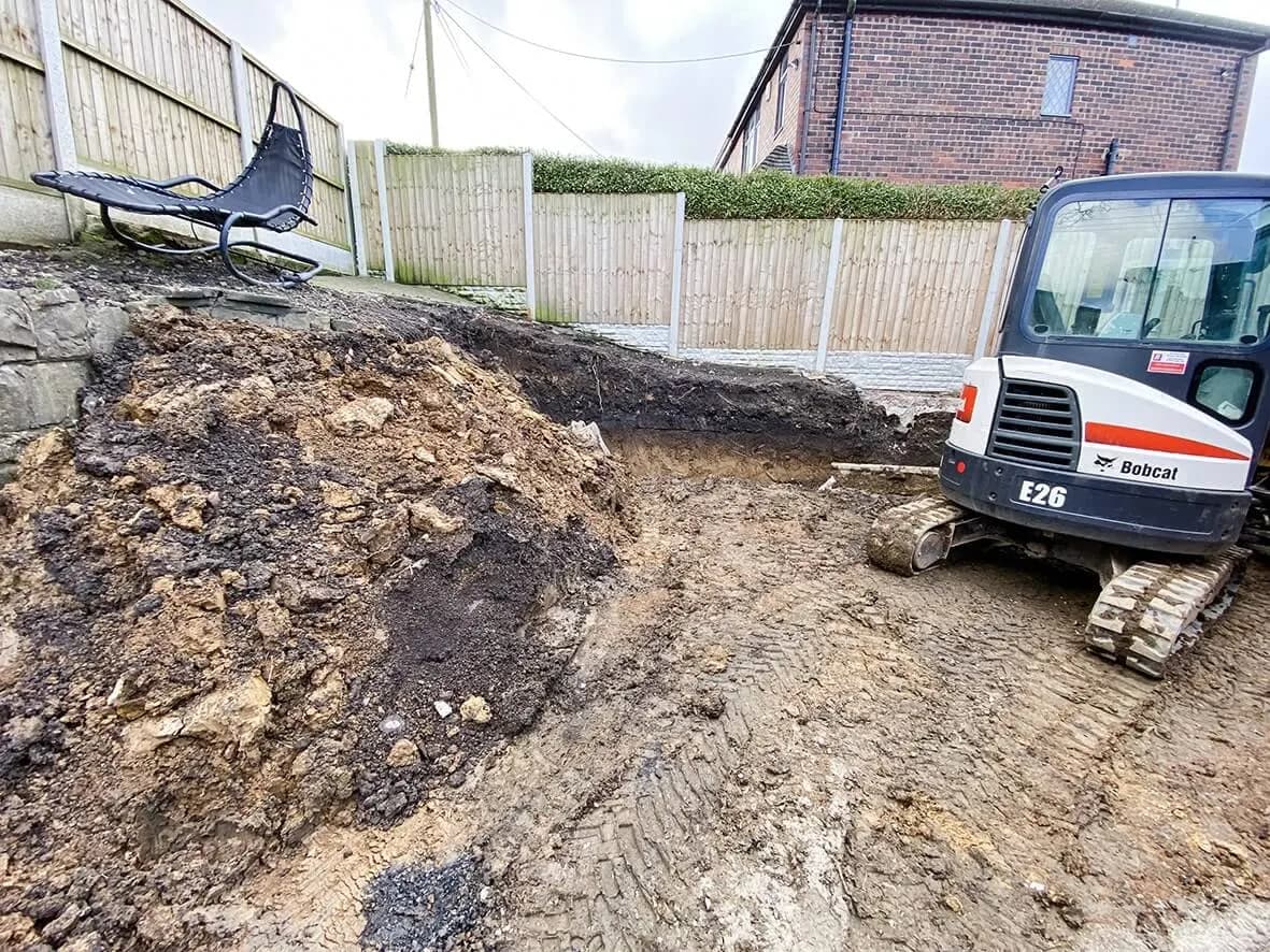 Mid-build · retaining wall rebuilt