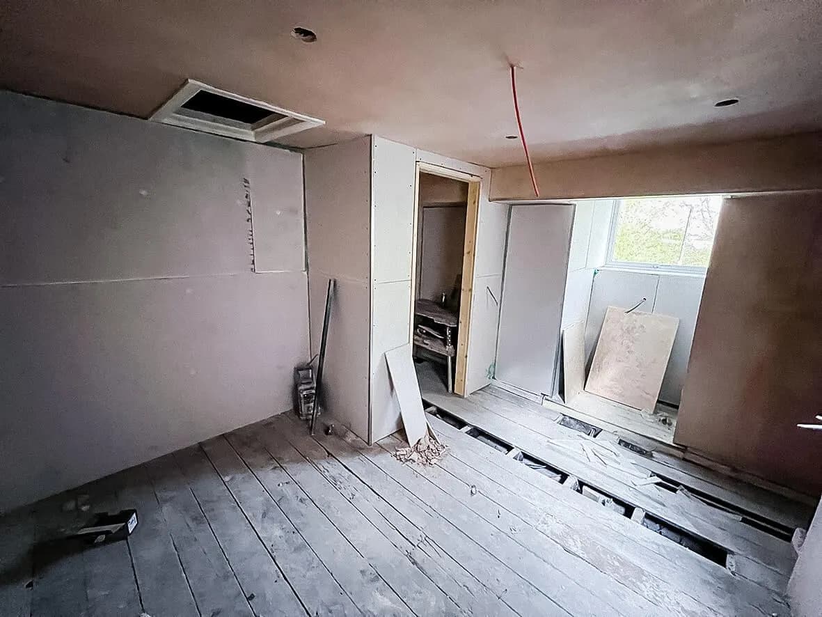 Mid-build · communal kitchen progressing